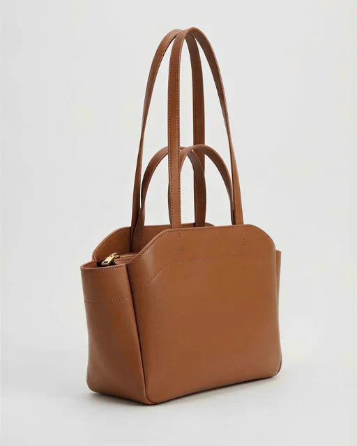 Zara Bag Brown – wing tote with hand loops and shoulder strap, three-quarter view