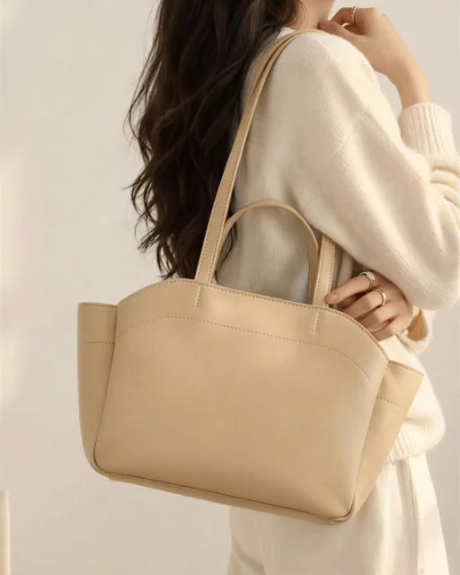 Zara Bag Beige worn on shoulder — beige wing tote as a shoulder bag
