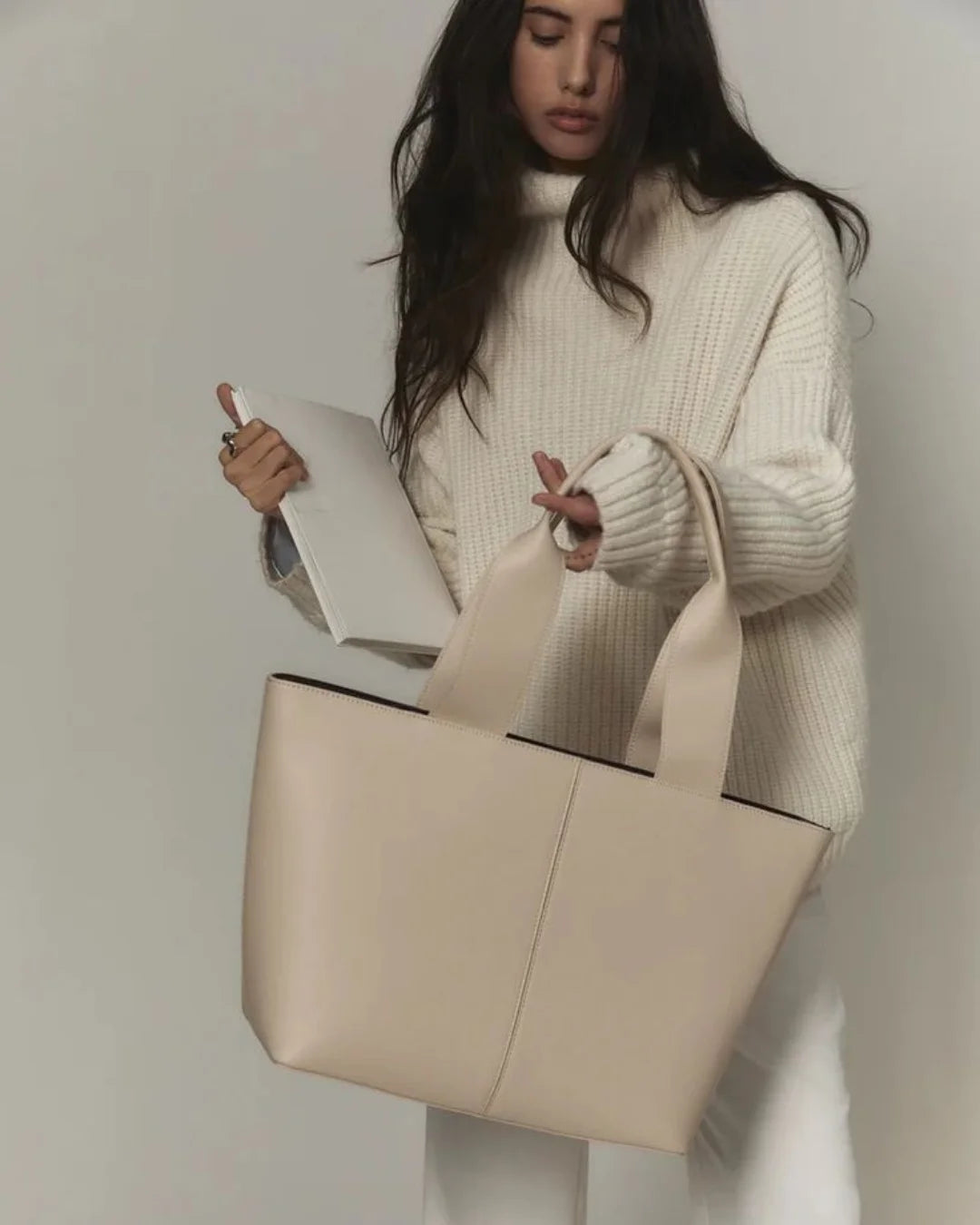 Woman Carrying Uni Tote Bag Beige – Chic Faux Leather Tote for University Girls & Working Women Pakistan