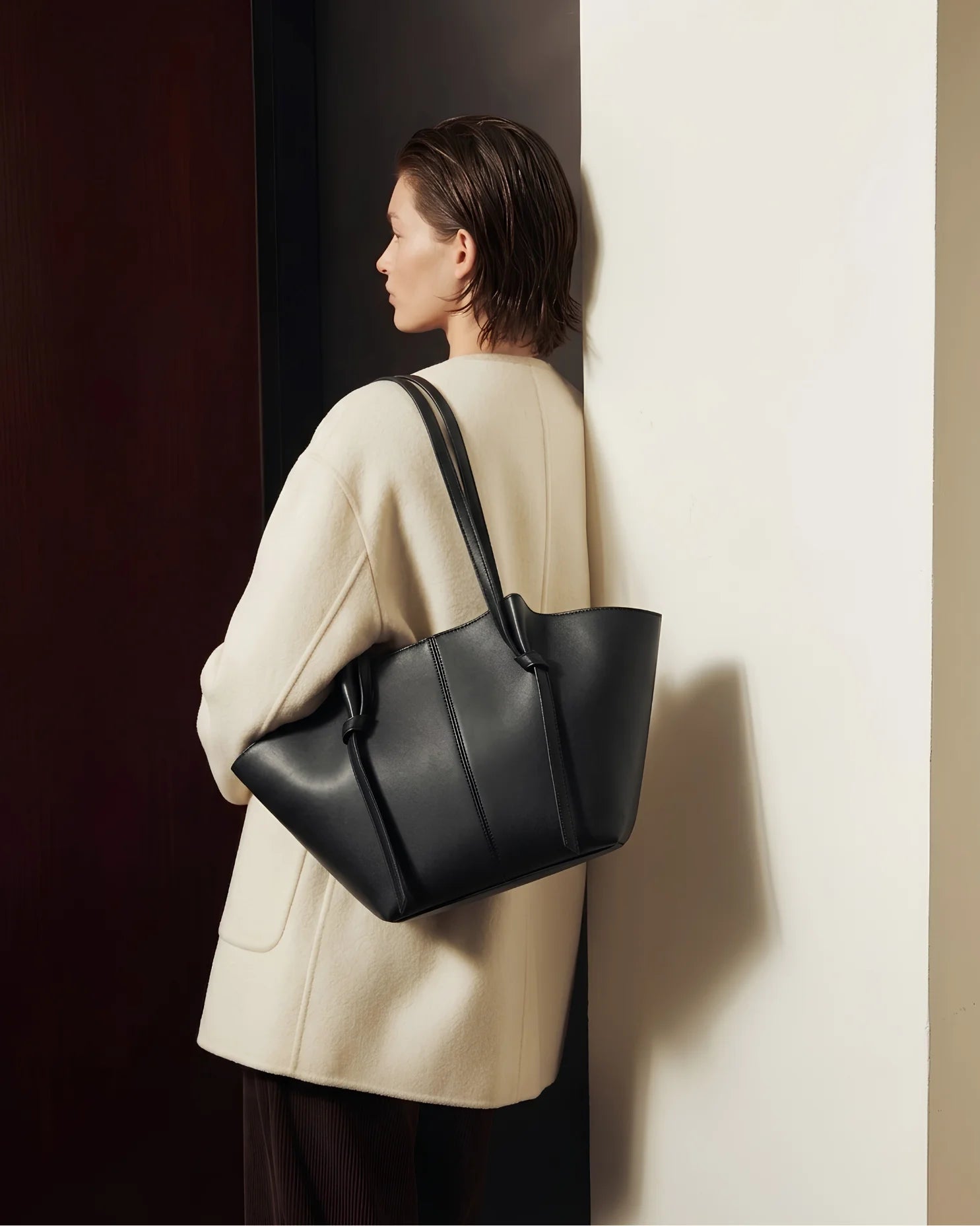 Woman carrying Amara Tote Black Bag — Office Tote Bag Women Pakistan