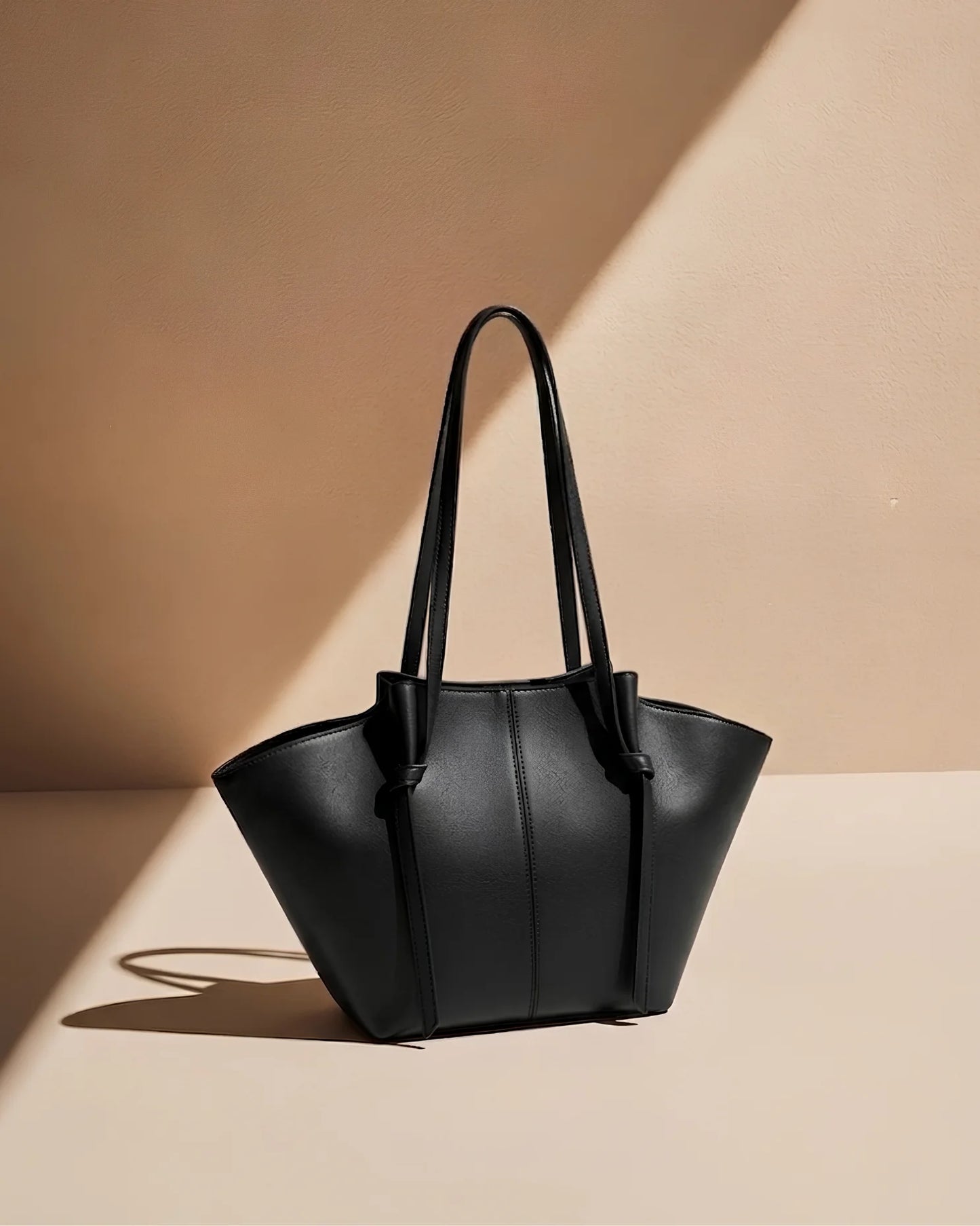 Amara Tote Black Bag on beige background — Luxury Tote Pakistan | MYLIGHT.PK