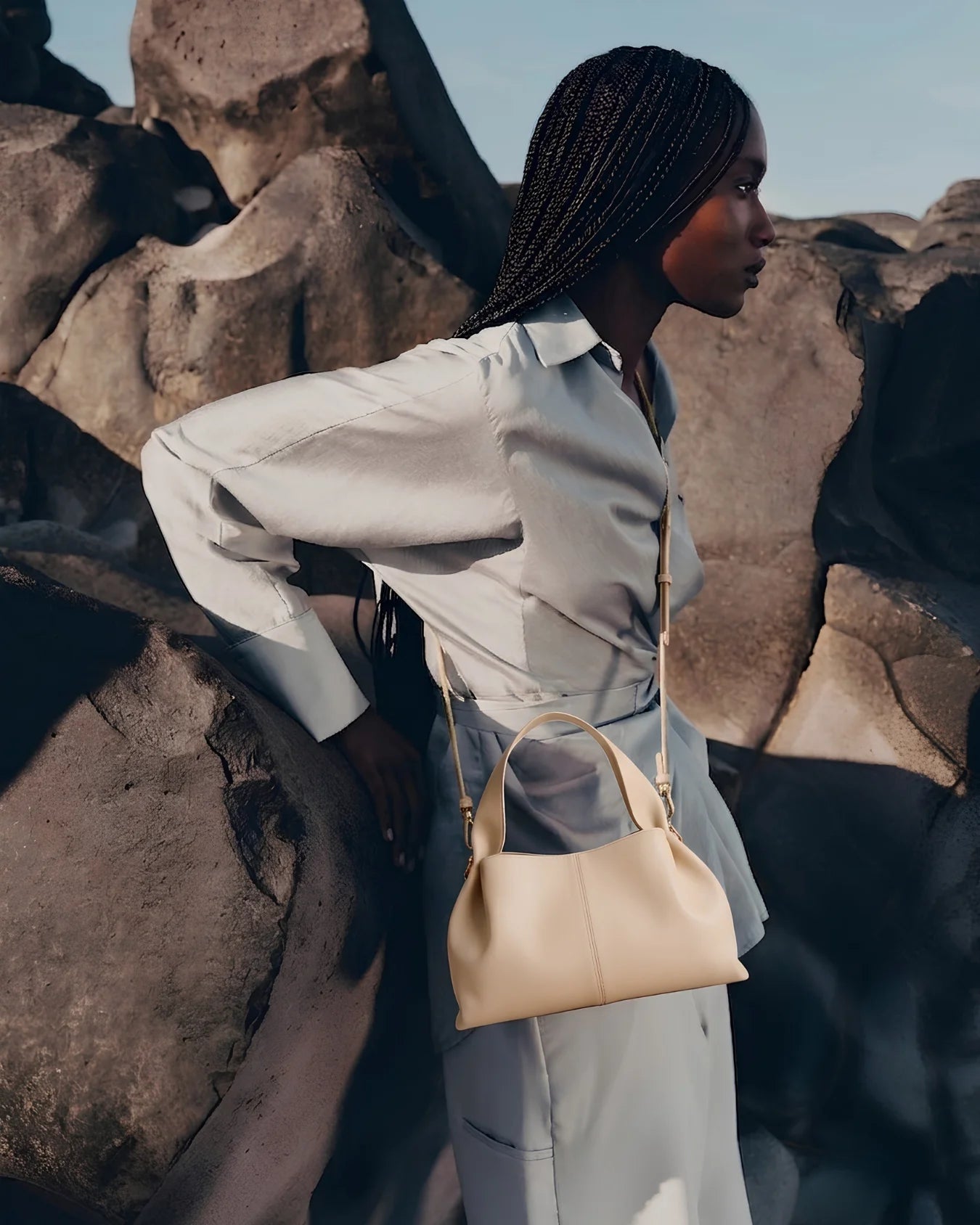 Stylish woman holding a beige leather shoulder bag in Pakistan - The Haven Collection by My Light