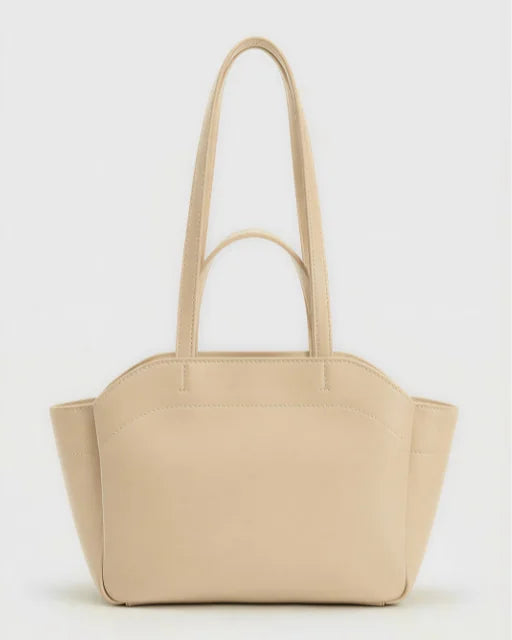 Front view of Zara Bag Beige — structured sand-beige wing tote with dual handles